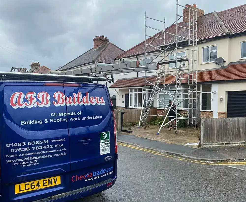 a blue van parked in front of a house