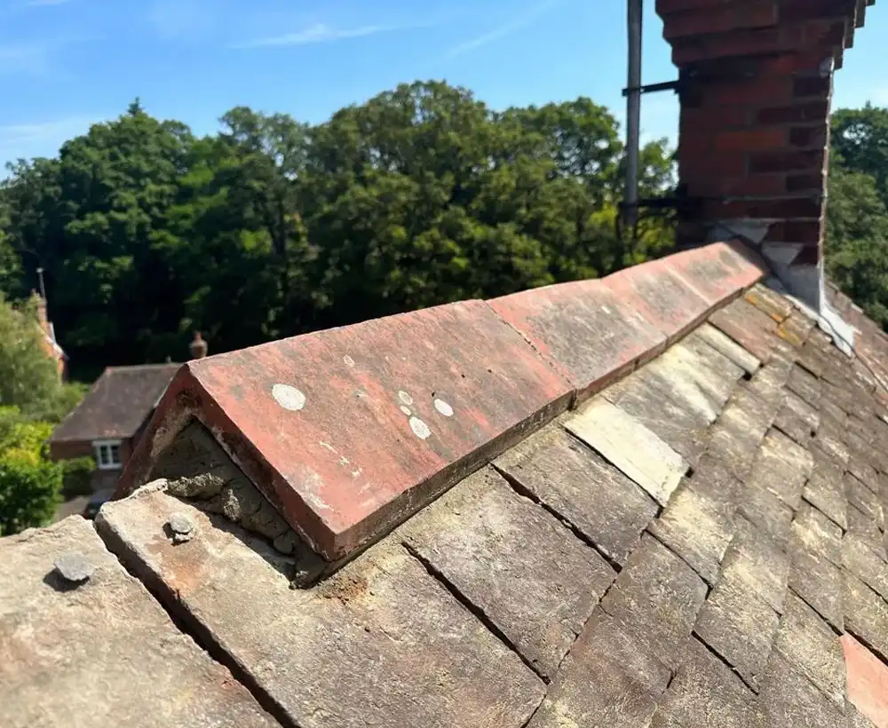 a brick chimney on top of a roof